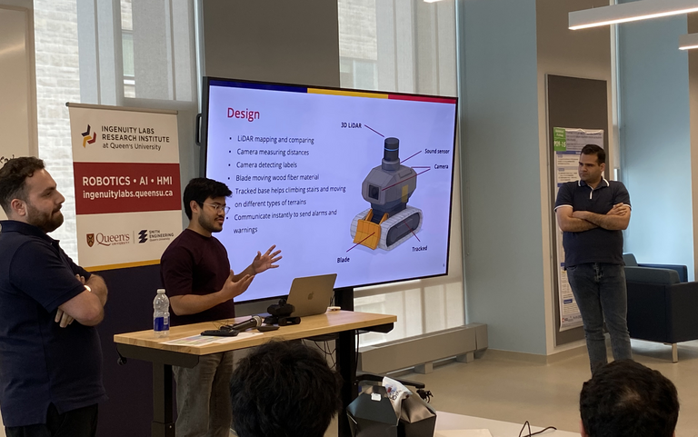 Three students presenting their inspection robot