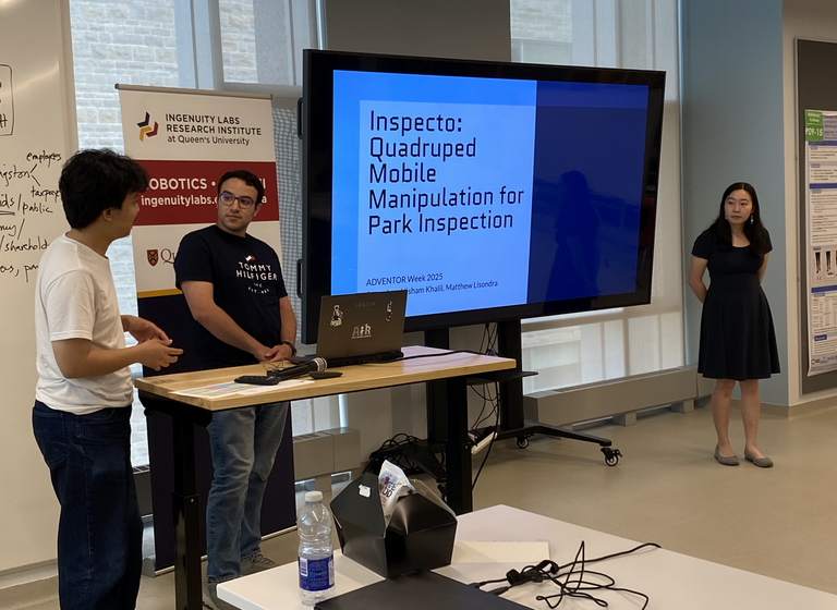 Three students presenting their inspection robot