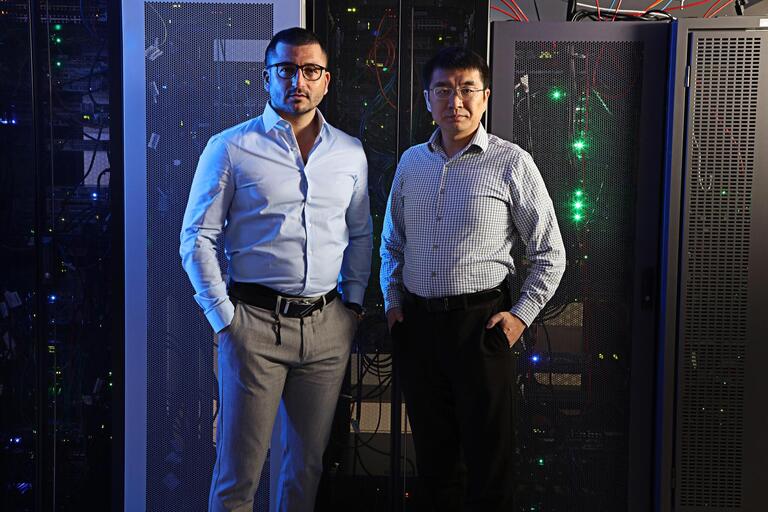 Samuel Dahan and Xioadan Zhu standing in front of our gpu cluster