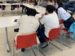 Students gathered around a table