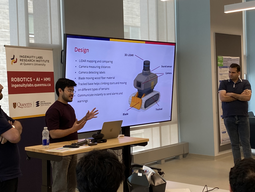Three students presenting their inspection robot