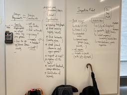 Design competition notes on a whiteboard