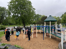 Students standing in a circle in a playground