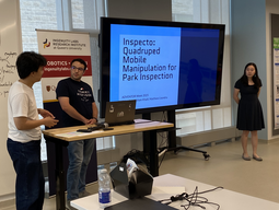 Three students presenting their inspection robot