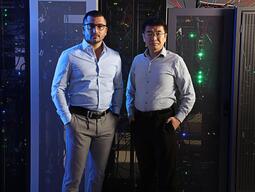 Samuel Dahan and Xioadan Zhu standing in front of our gpu cluster