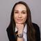 Head and shoulders picture of Dr. Ceren Kolsarici with her hand under her chin