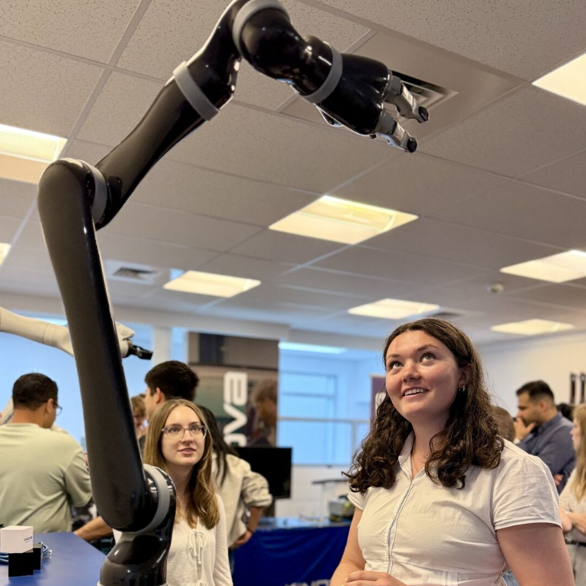 Student using a robot arm