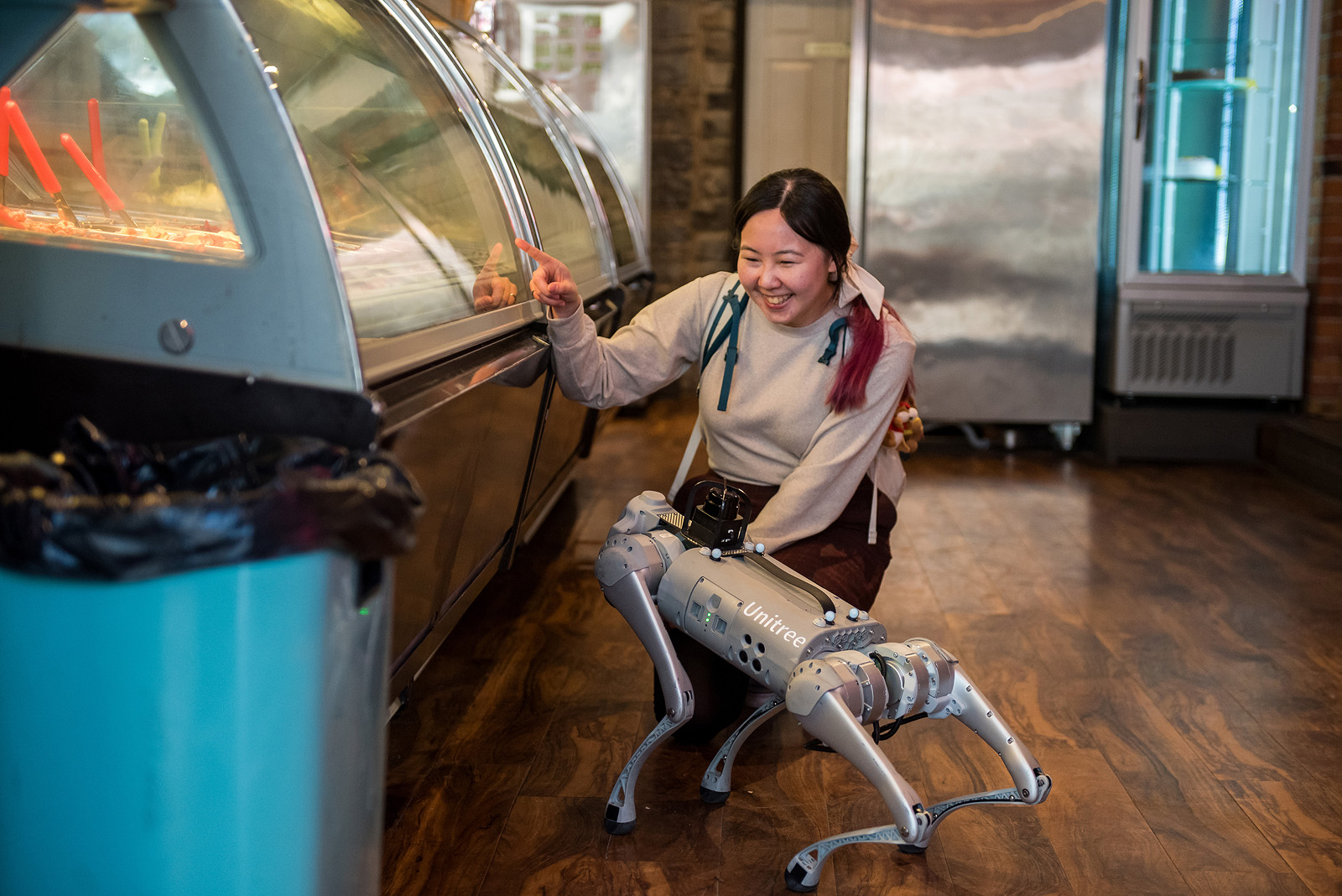 Robot dog and student looking at ice cream